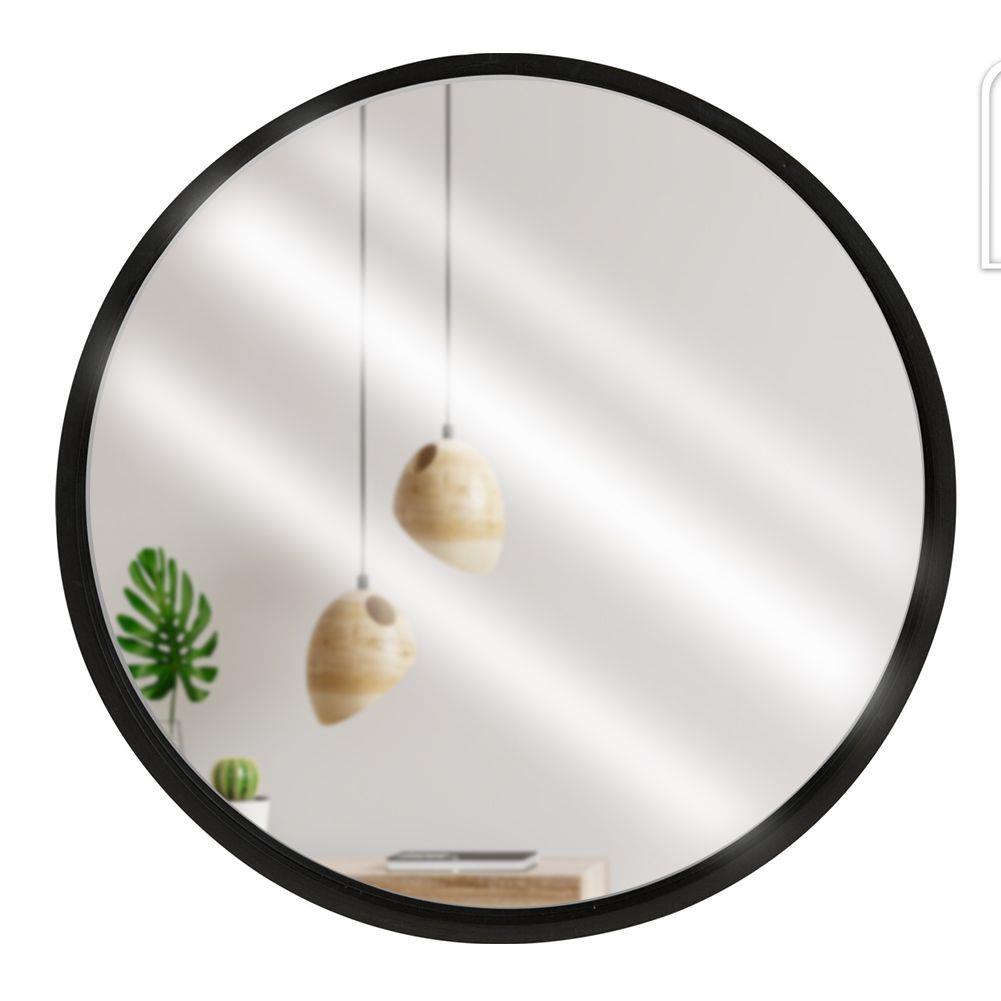 Okrúhle zrkadlo v rámci čiernej steny okolo 30 cm